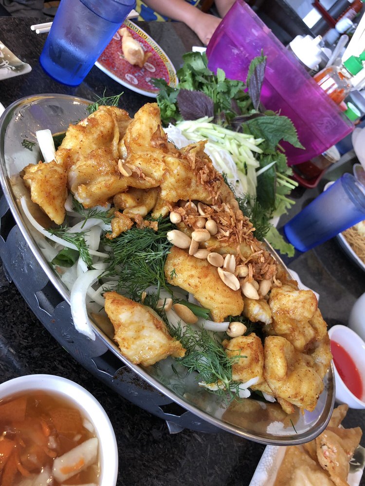 Turmeric fried fish with dill, onions and peanuts